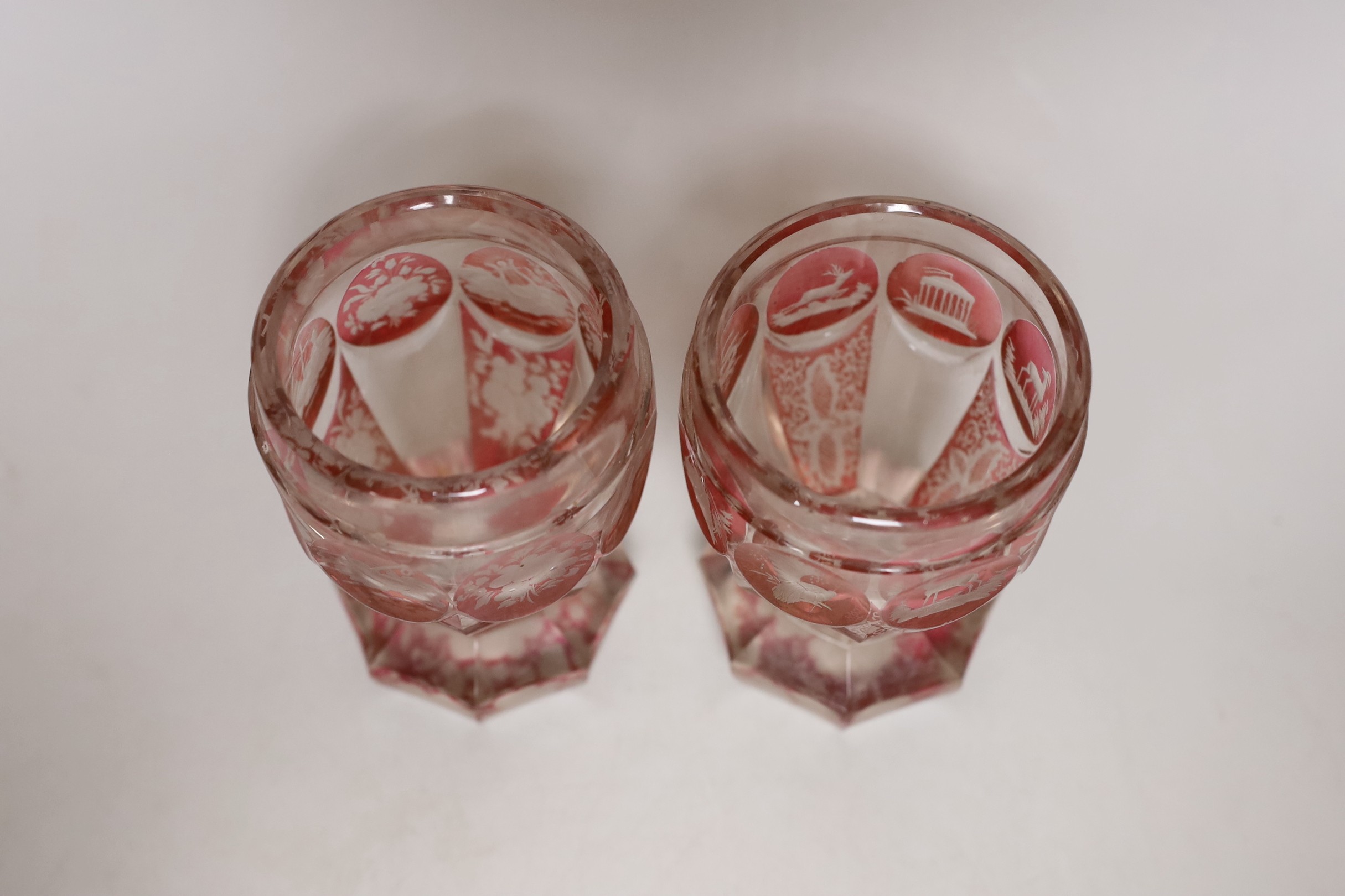 A pair of late 19th century Bohemian wheel engraved ruby stained glass beakers, 13.5cms high